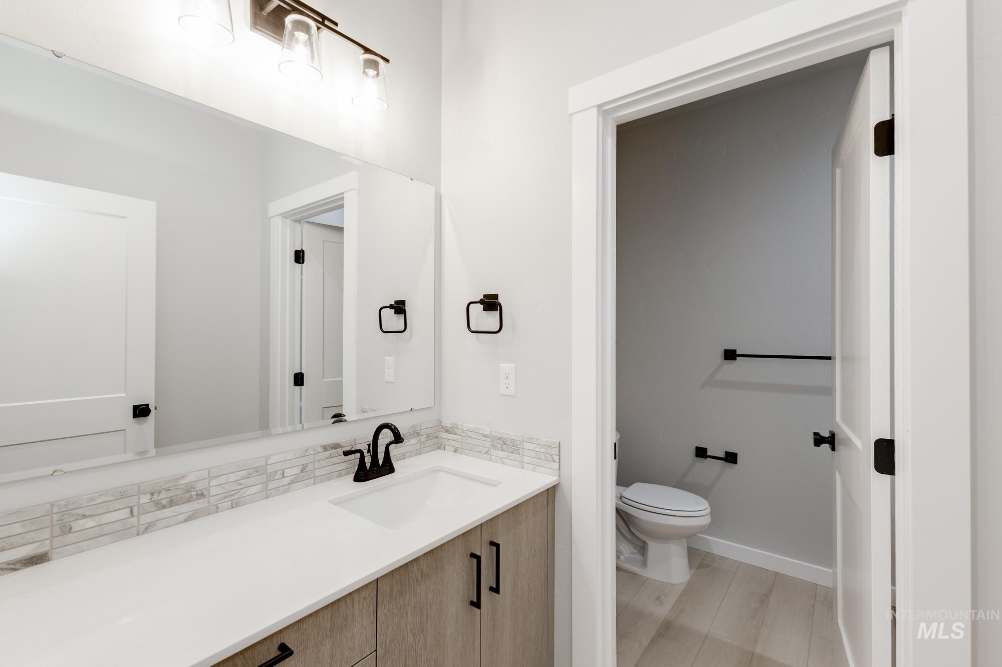 6494 South Sunfish Avenue Boise, ID 83709 - Photo 23 of 32 Bathroom featuring toilet and vanity