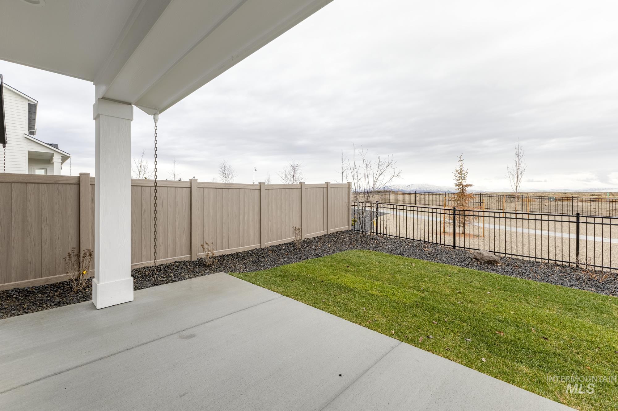 6494 South Sunfish Avenue Boise, ID 83709 - Photo 29 of 32 Fenced backyard with a patio