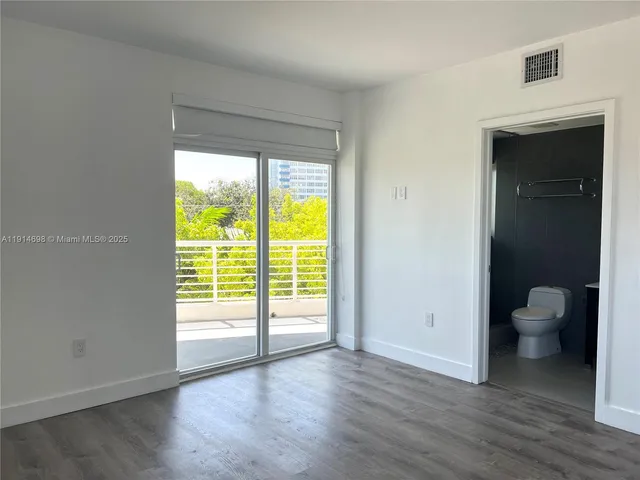a bathroom with a toilet a sink and a shower