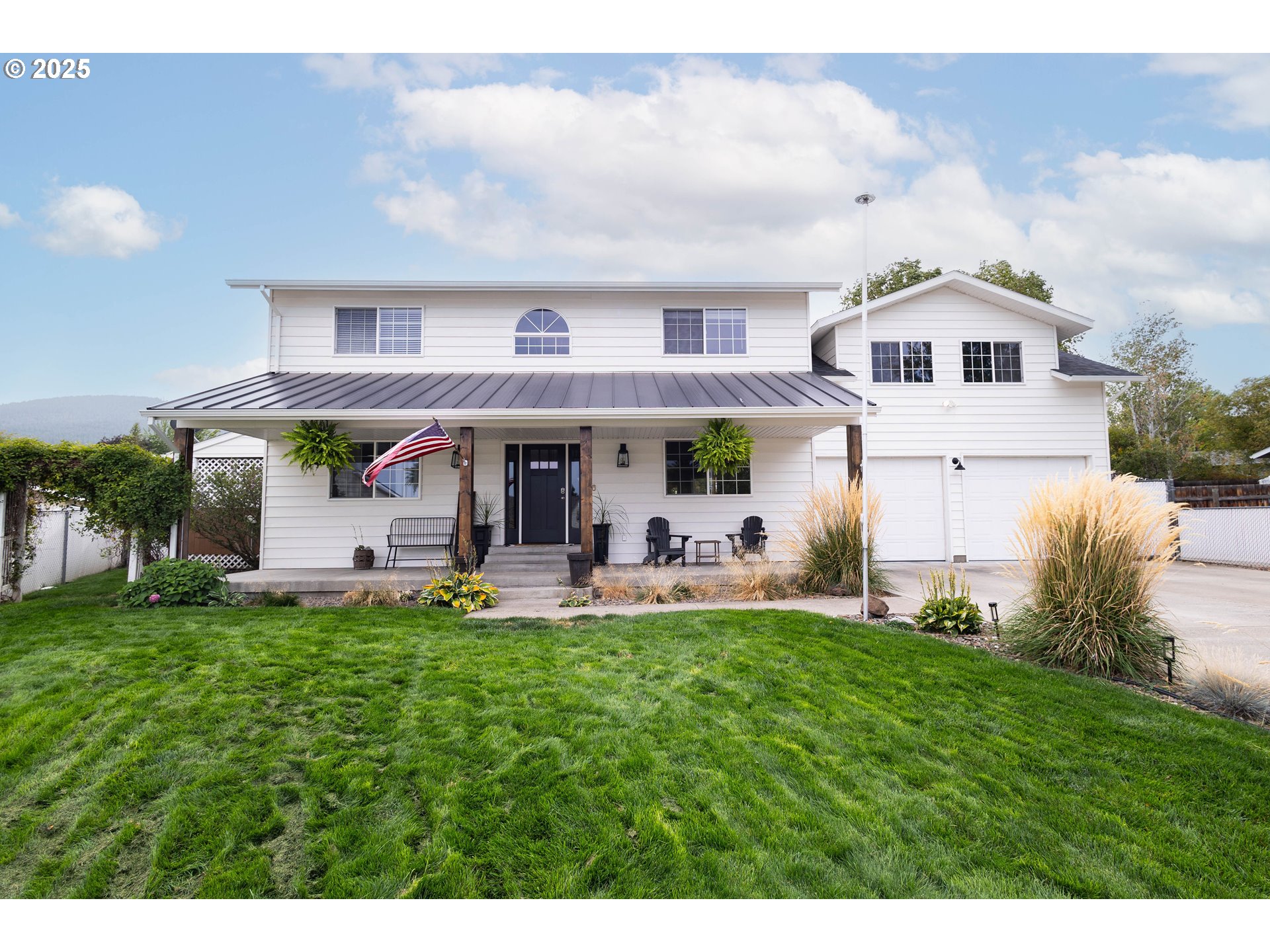 a view of a house with a yard porch and sitting area