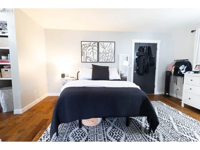 a bedroom with a bed and dresser