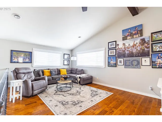 a living room with furniture rug and window