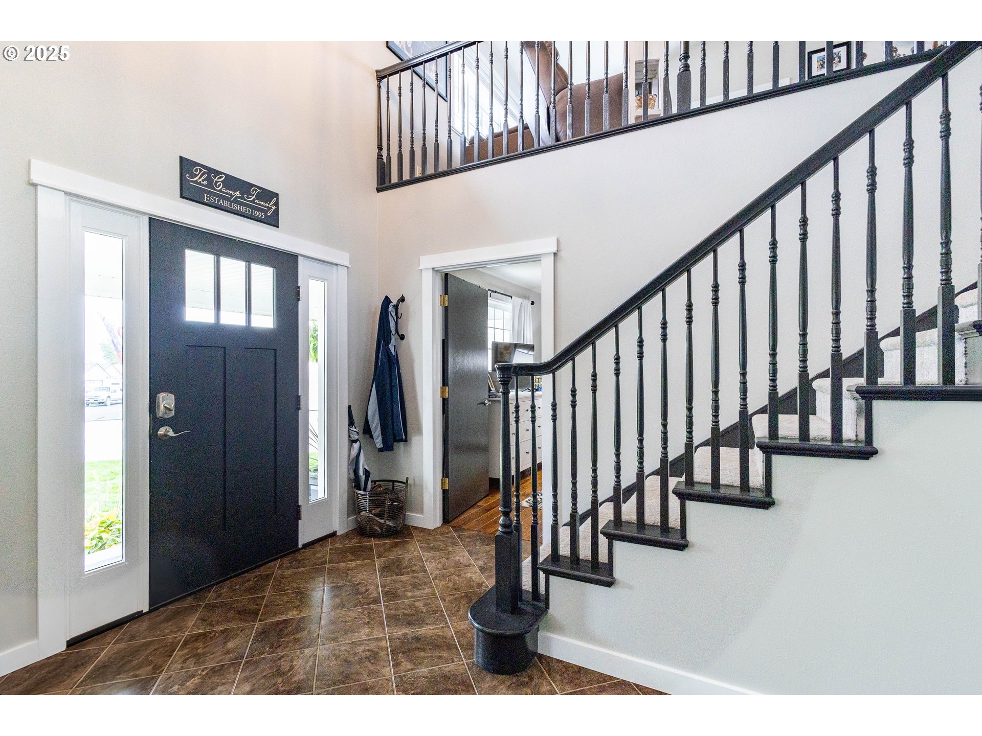 2000 Scorpio Drive La Grande, OR 97850 - Photo 2 of 36 a view of staircase with lots of frames and frames on wall