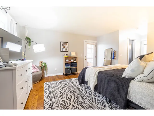 a bedroom with a bed and a couch