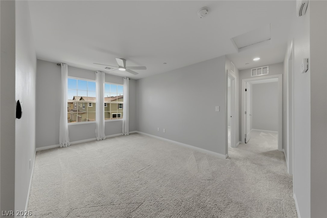 3564 Credere Lane Henderson, NV 89074 - Photo 14 of 40 Unfurnished room featuring light colored carpet and a ceiling fan