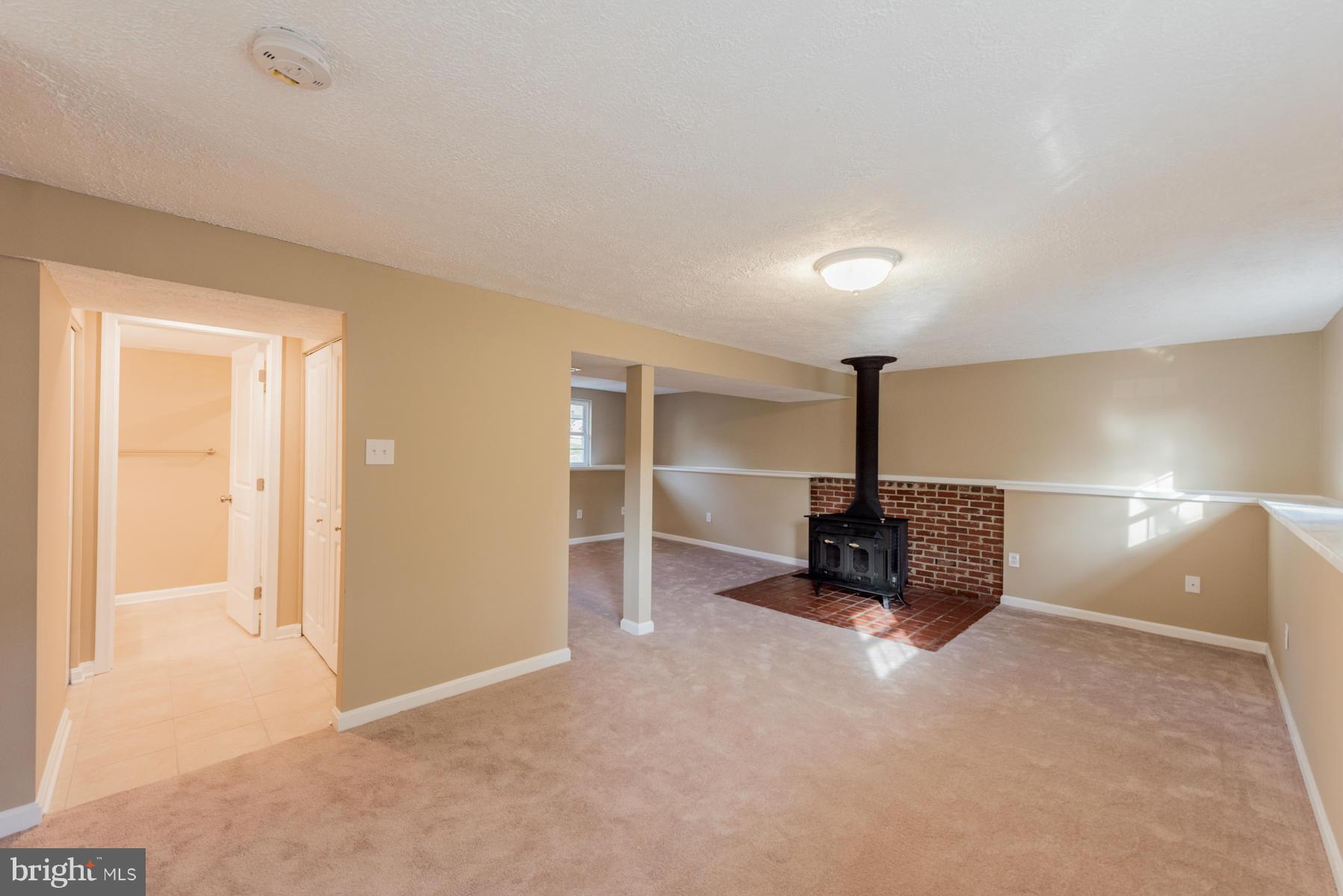 5116 Clifford Road Perry Hall, MD 21128 - Photo 22 of 30 Basement w/wood burning FP