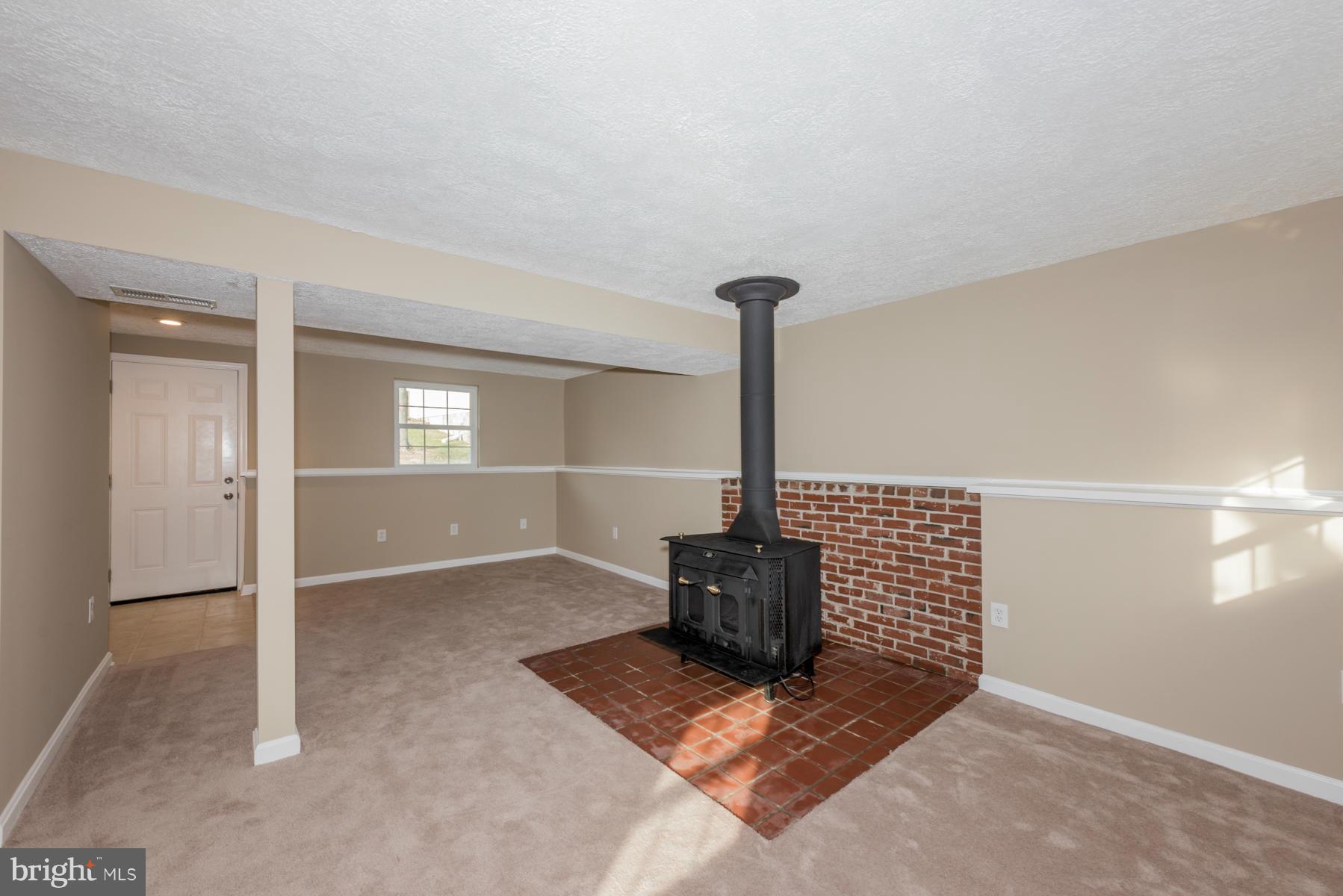 5116 Clifford Road Perry Hall, MD 21128 - Photo 24 of 30 Basement w/wood burning stove