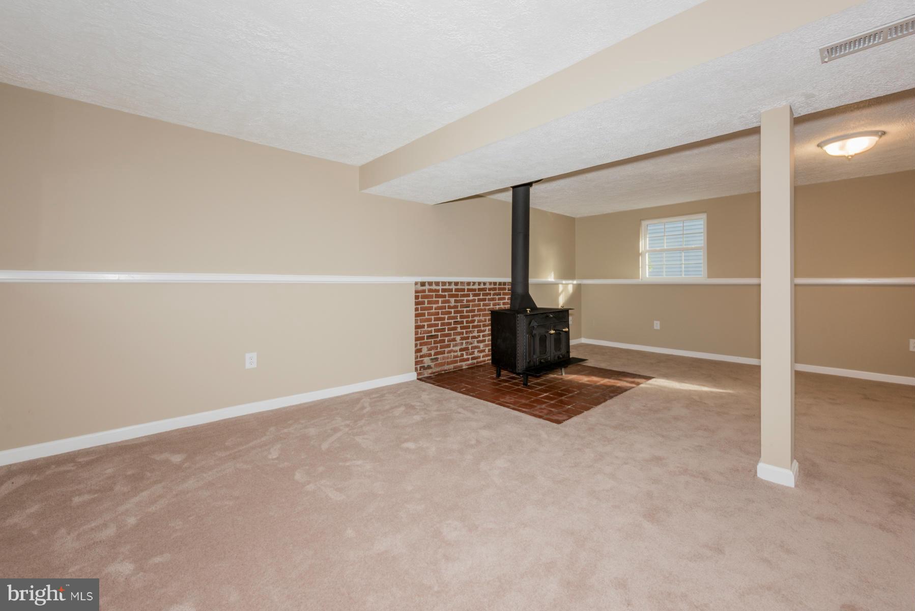 5116 Clifford Road Perry Hall, MD 21128 - Photo 25 of 30 Basement w/wood burning stove