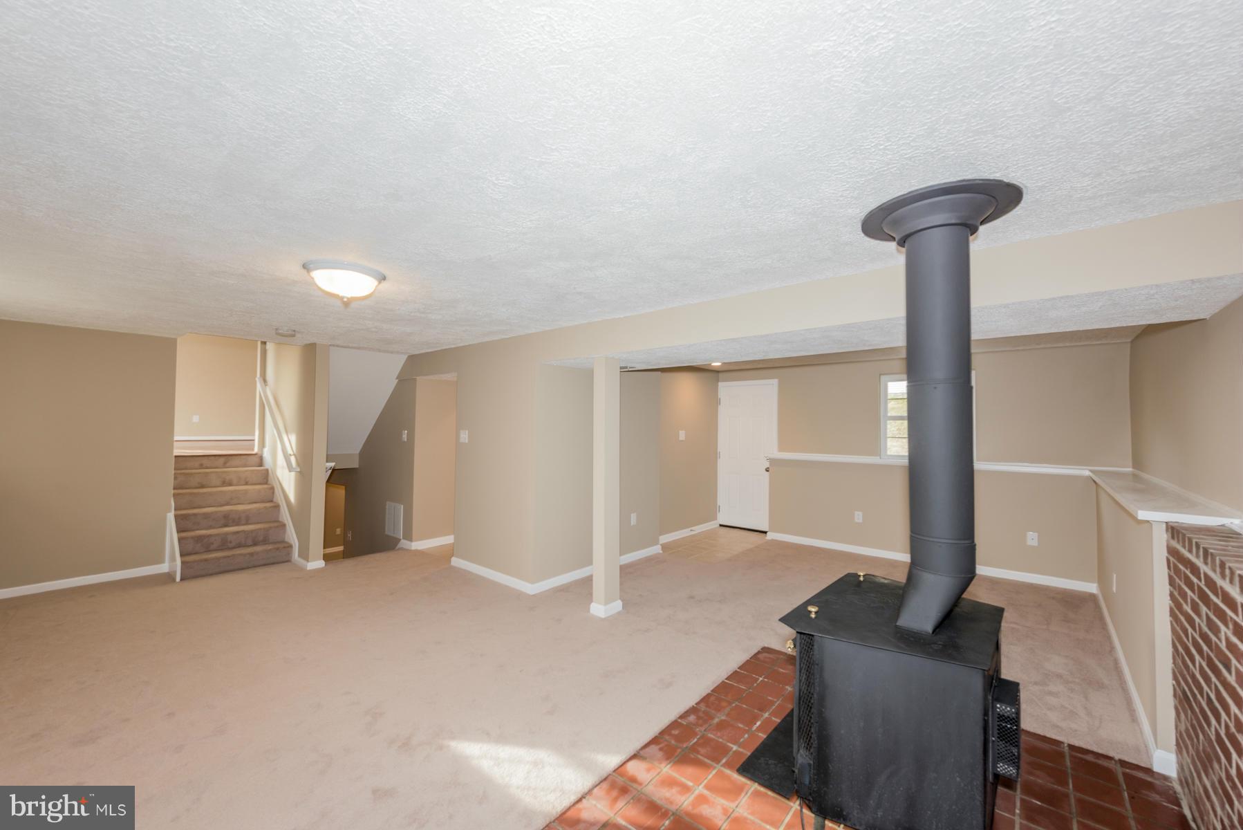 5116 Clifford Road Perry Hall, MD 21128 - Photo 26 of 30 Basement w/wood burning stove