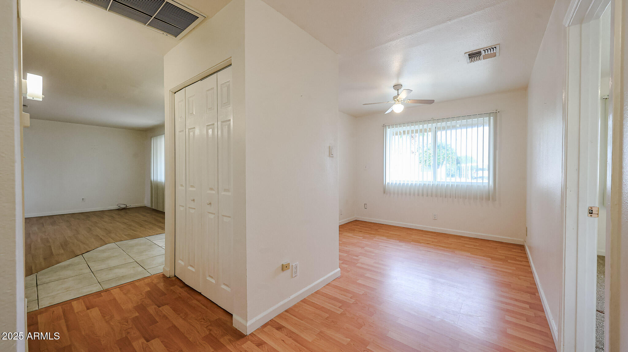 11851 North Thunderbird Road Sun City, AZ 85351 - Photo 19 of 46 a view of livingroom with hardwood floor and hallway