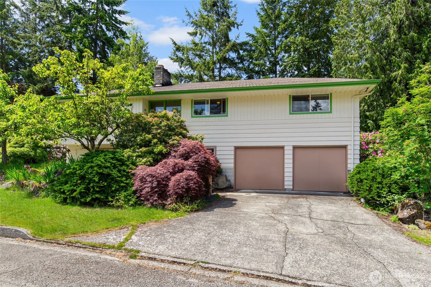 17543 7th Avenue Northeast Shoreline, WA 98155 - Photo 1 of 37 a front view of house with a garden