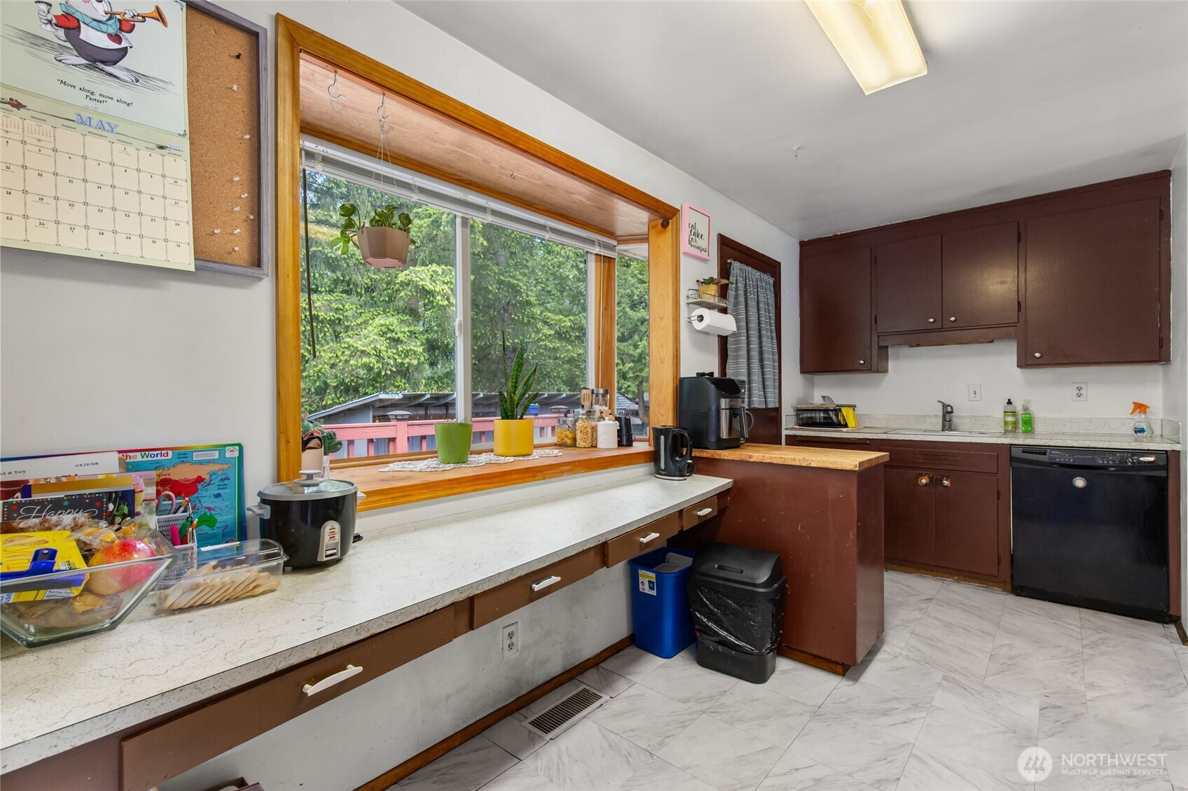 17543 7th Avenue Northeast Shoreline, WA 98155 - Photo 11 of 37 a kitchen with stainless steel appliances granite countertop a sink and a refrigerator