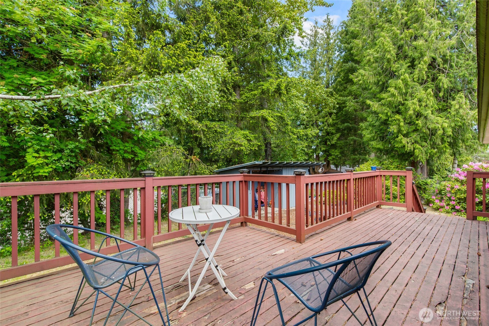 17543 7th Avenue Northeast Shoreline, WA 98155 - Photo 14 of 37 a view of a chair and table on the wooden deck