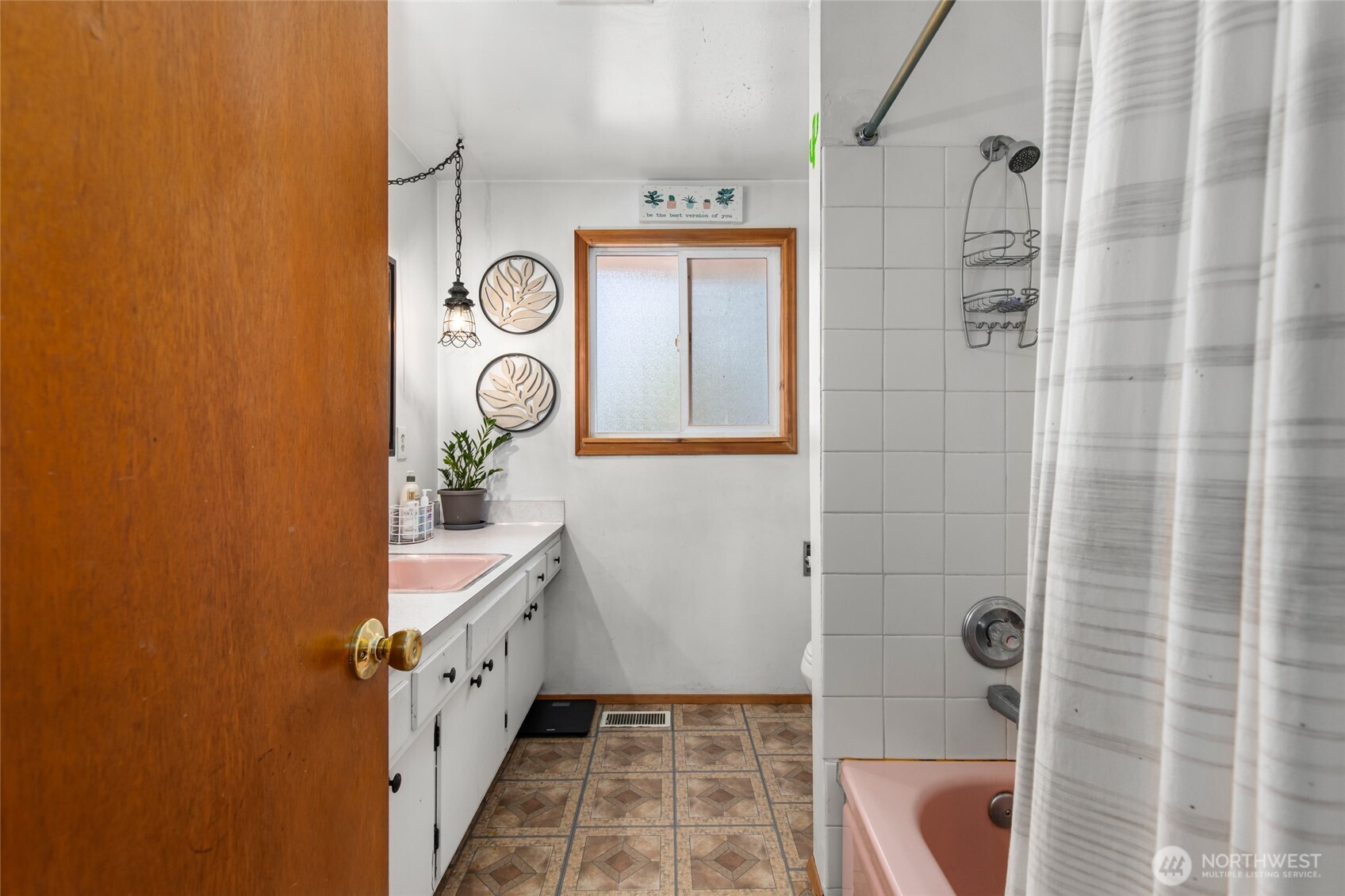 17543 7th Avenue Northeast Shoreline, WA 98155 - Photo 17 of 37 a bathroom with a double vanity sink a mirror and shower