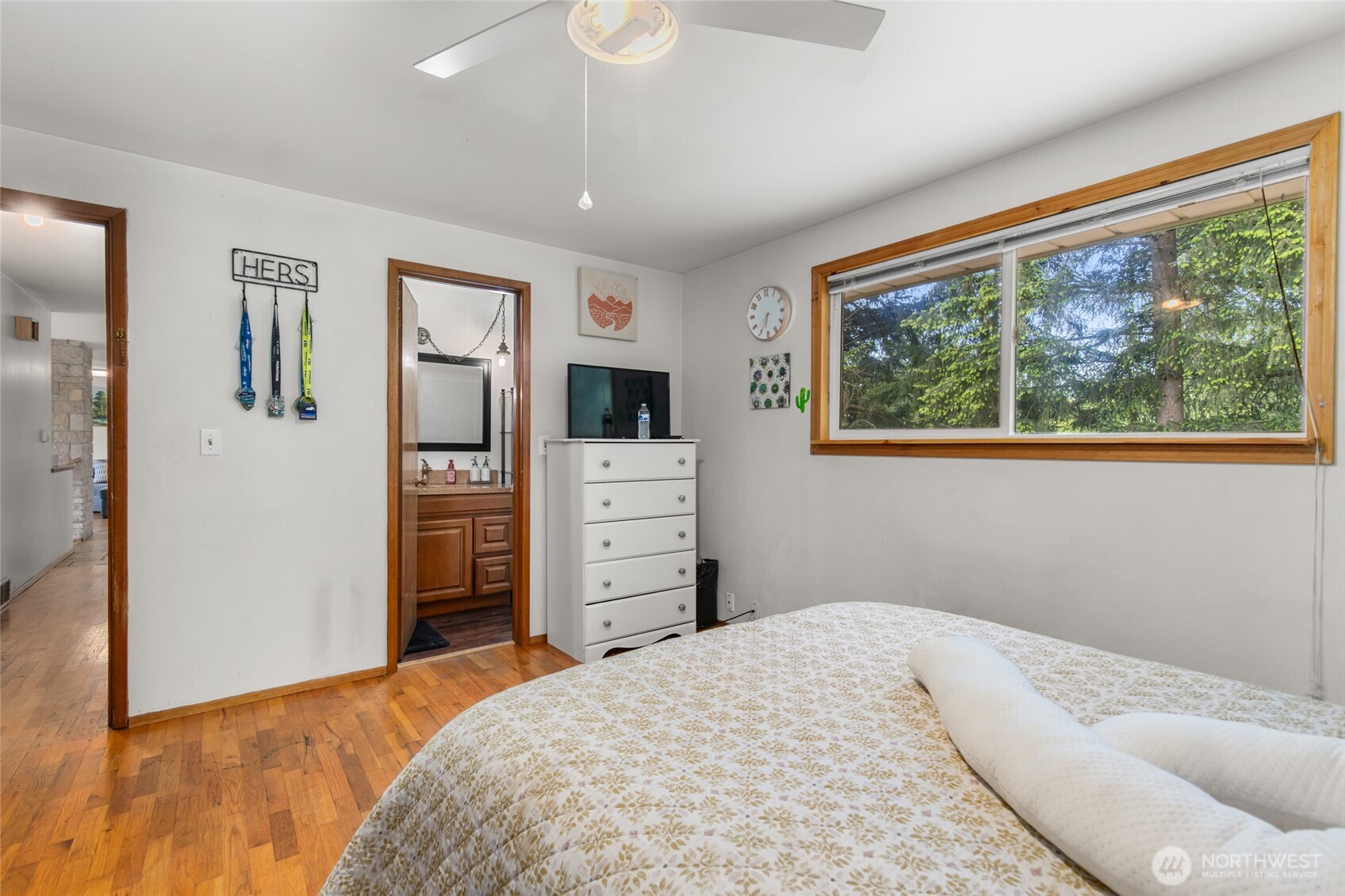 17543 7th Avenue Northeast Shoreline, WA 98155 - Photo 19 of 37 a bedroom with a bed and a flat tv screen