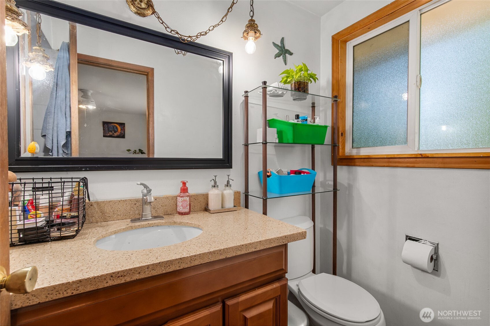 17543 7th Avenue Northeast Shoreline, WA 98155 - Photo 20 of 37 a bathroom with a toilet sink and mirror