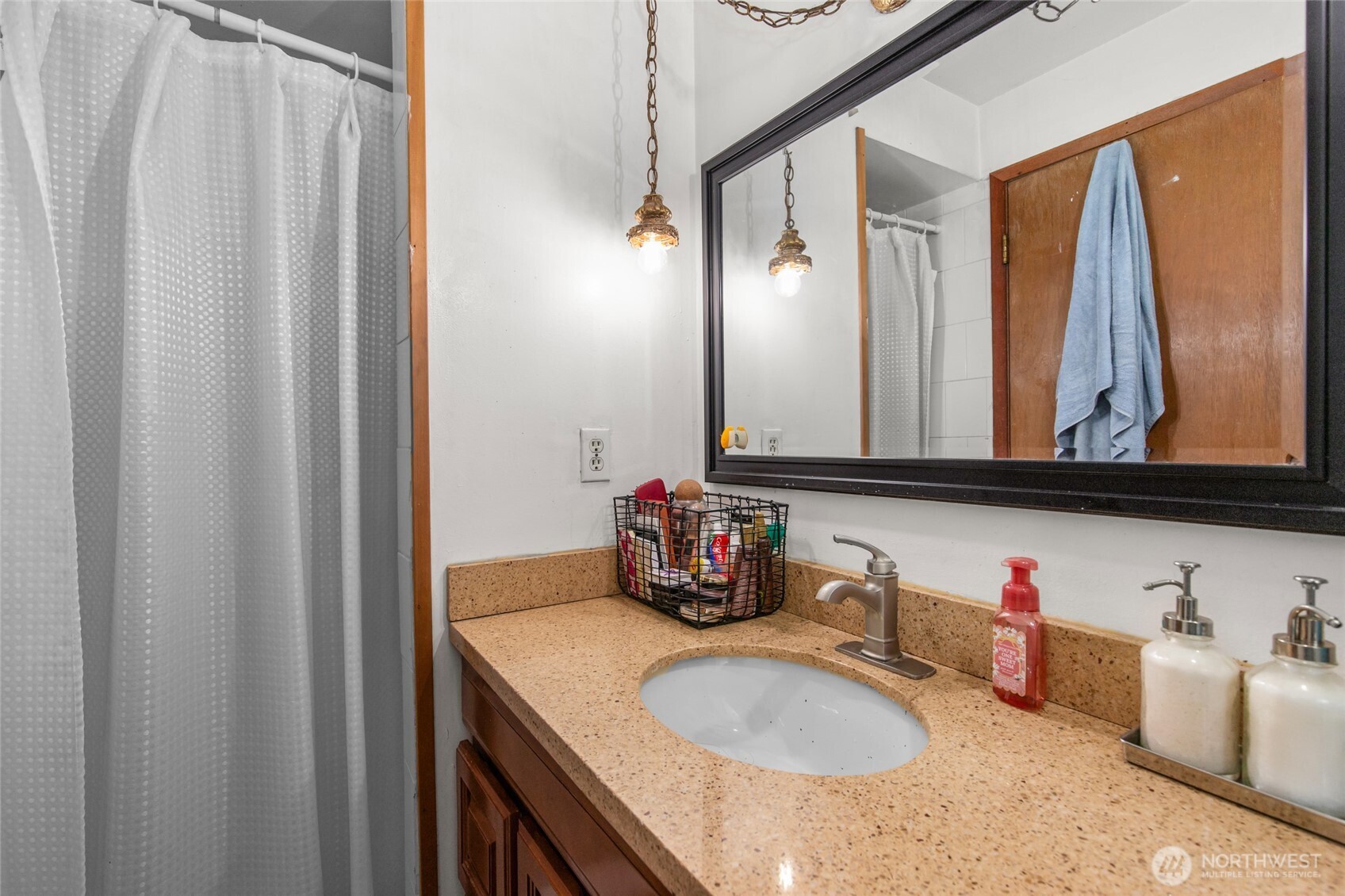 17543 7th Avenue Northeast Shoreline, WA 98155 - Photo 21 of 37 a bathroom with a sink vanity and a mirror