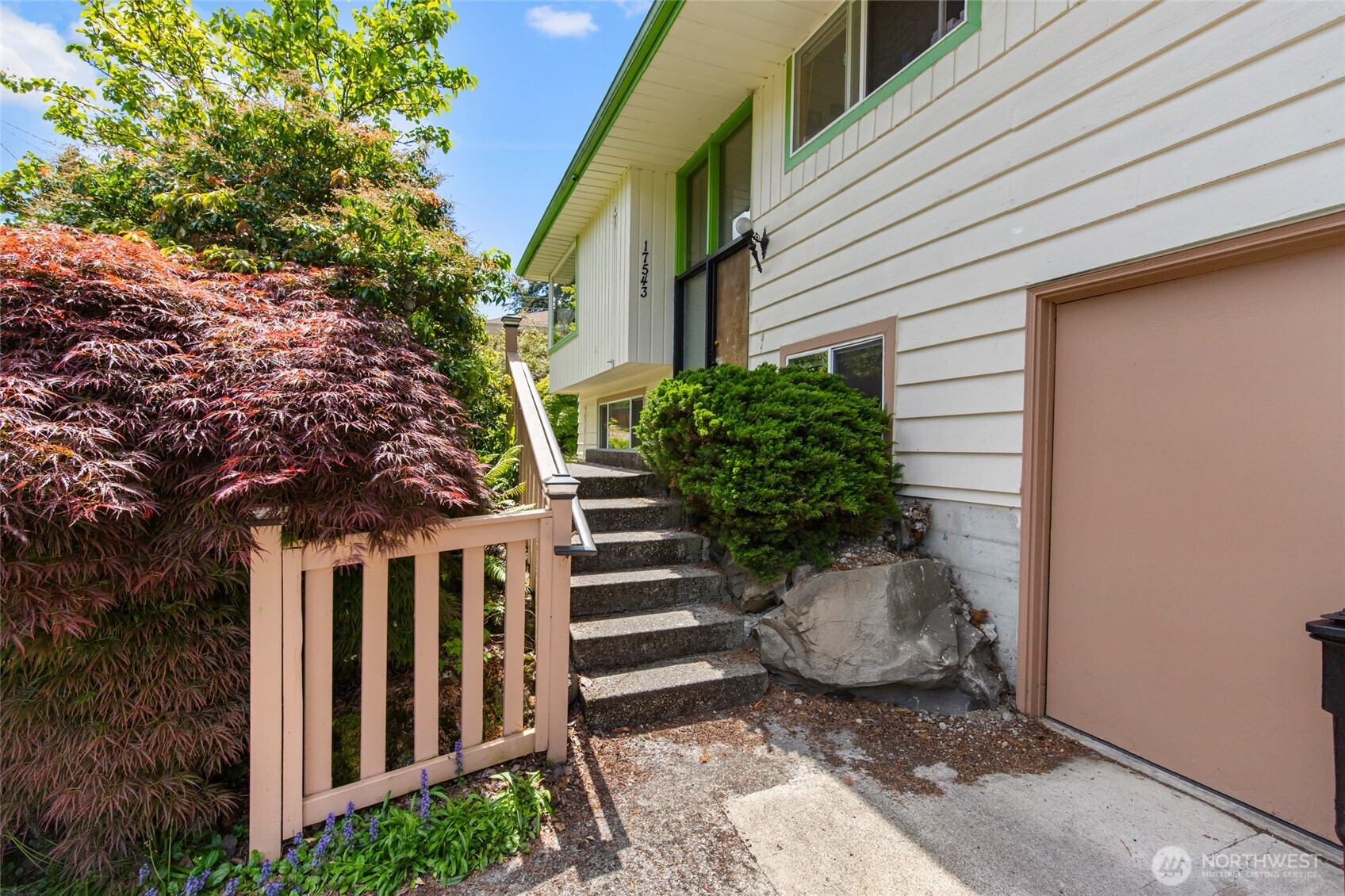 17543 7th Avenue Northeast Shoreline, WA 98155 - Photo 3 of 37 a view of a backyard with potted plants