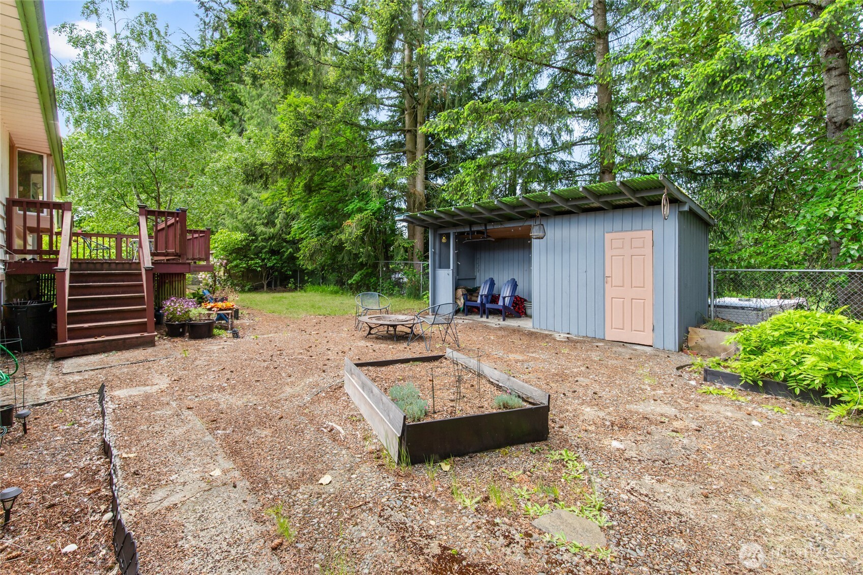 17543 7th Avenue Northeast Shoreline, WA 98155 - Photo 31 of 37 a view of a backyard with a garden and trees