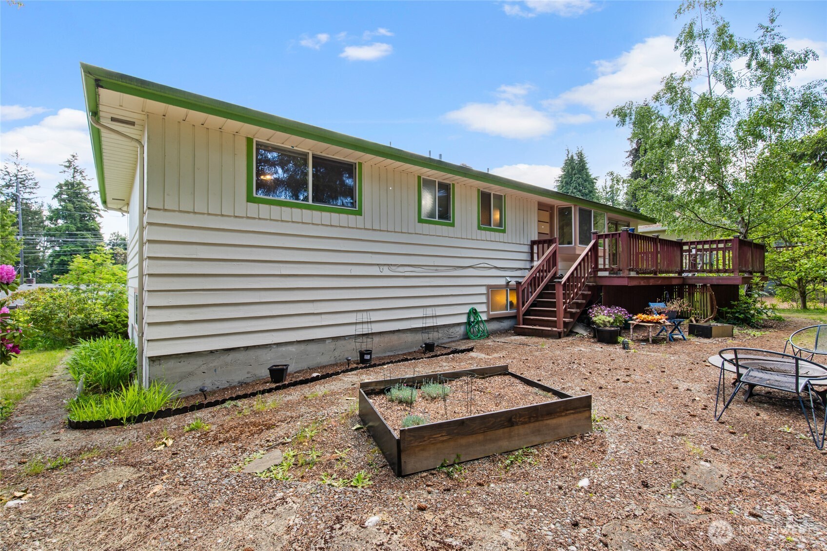 17543 7th Avenue Northeast Shoreline, WA 98155 - Photo 32 of 37 a view of a house with backyard and sitting area