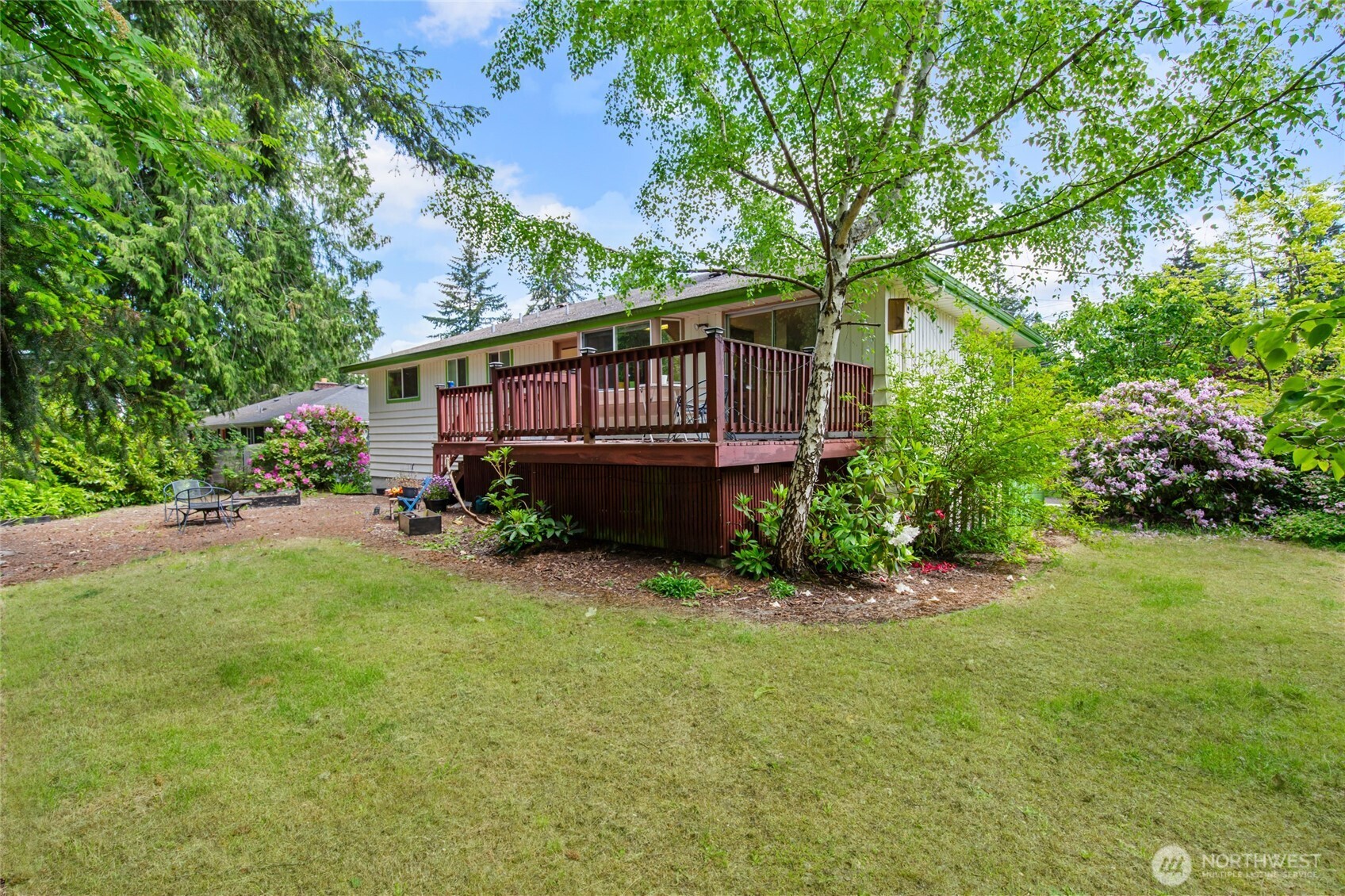 17543 7th Avenue Northeast Shoreline, WA 98155 - Photo 34 of 37 a view of a house with a big yard plants and large trees