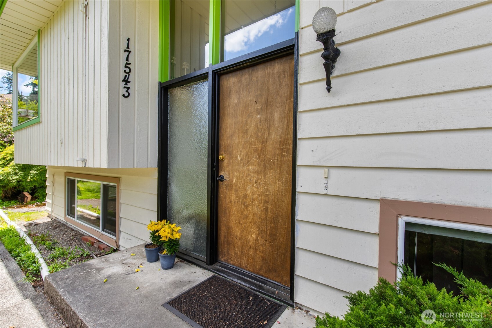 17543 7th Avenue Northeast Shoreline, WA 98155 - Photo 4 of 37 a view of front door of house