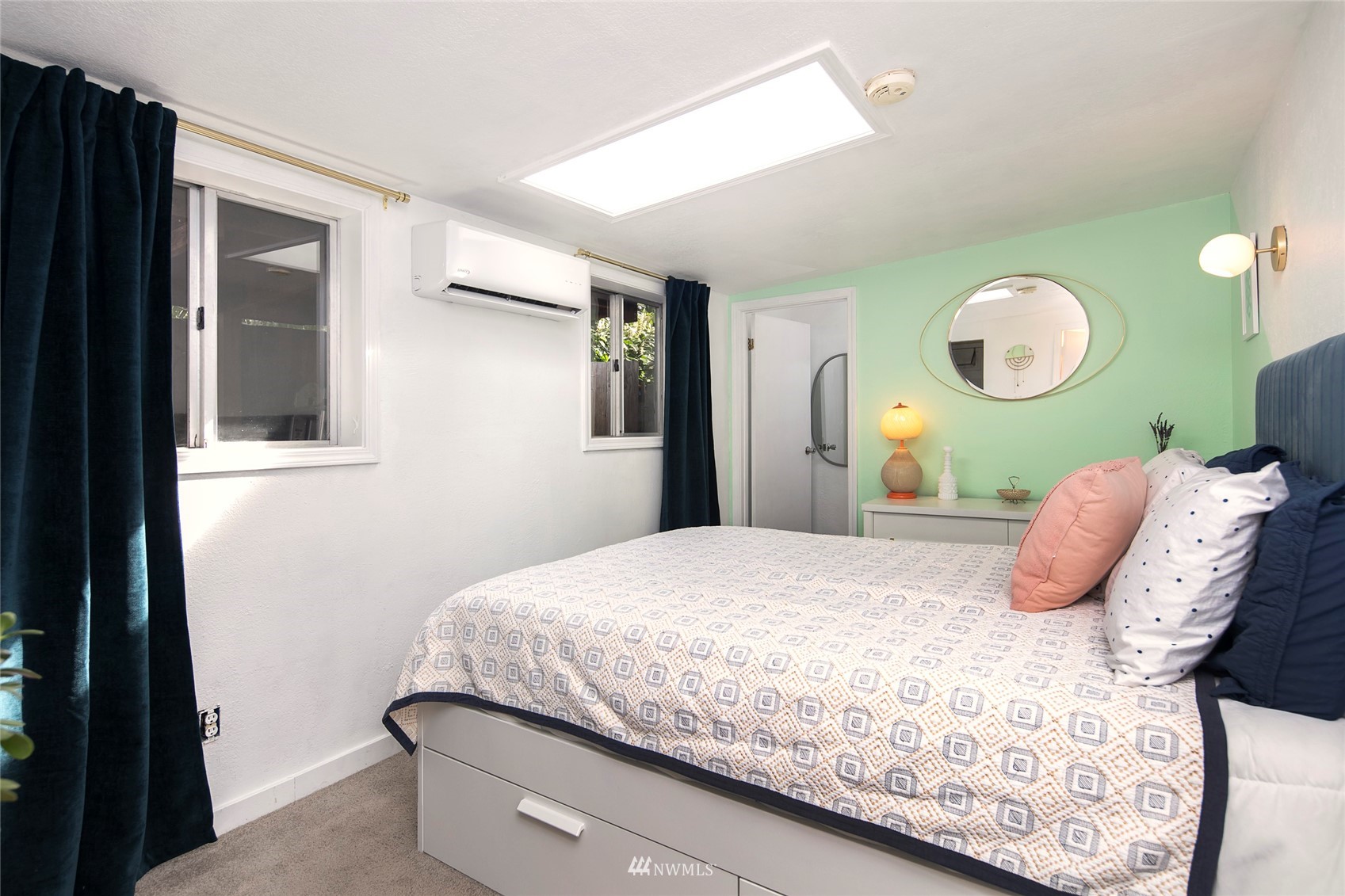 7141 47th Avenue Southwest Seattle, WA 98136 - Photo 15 of 27 a bedroom with a bed and window