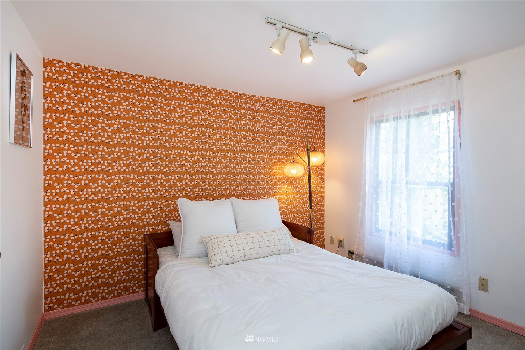 7141 47th Avenue Southwest Seattle, WA 98136 - Photo 16 of 27 a bedroom with a bed and a window