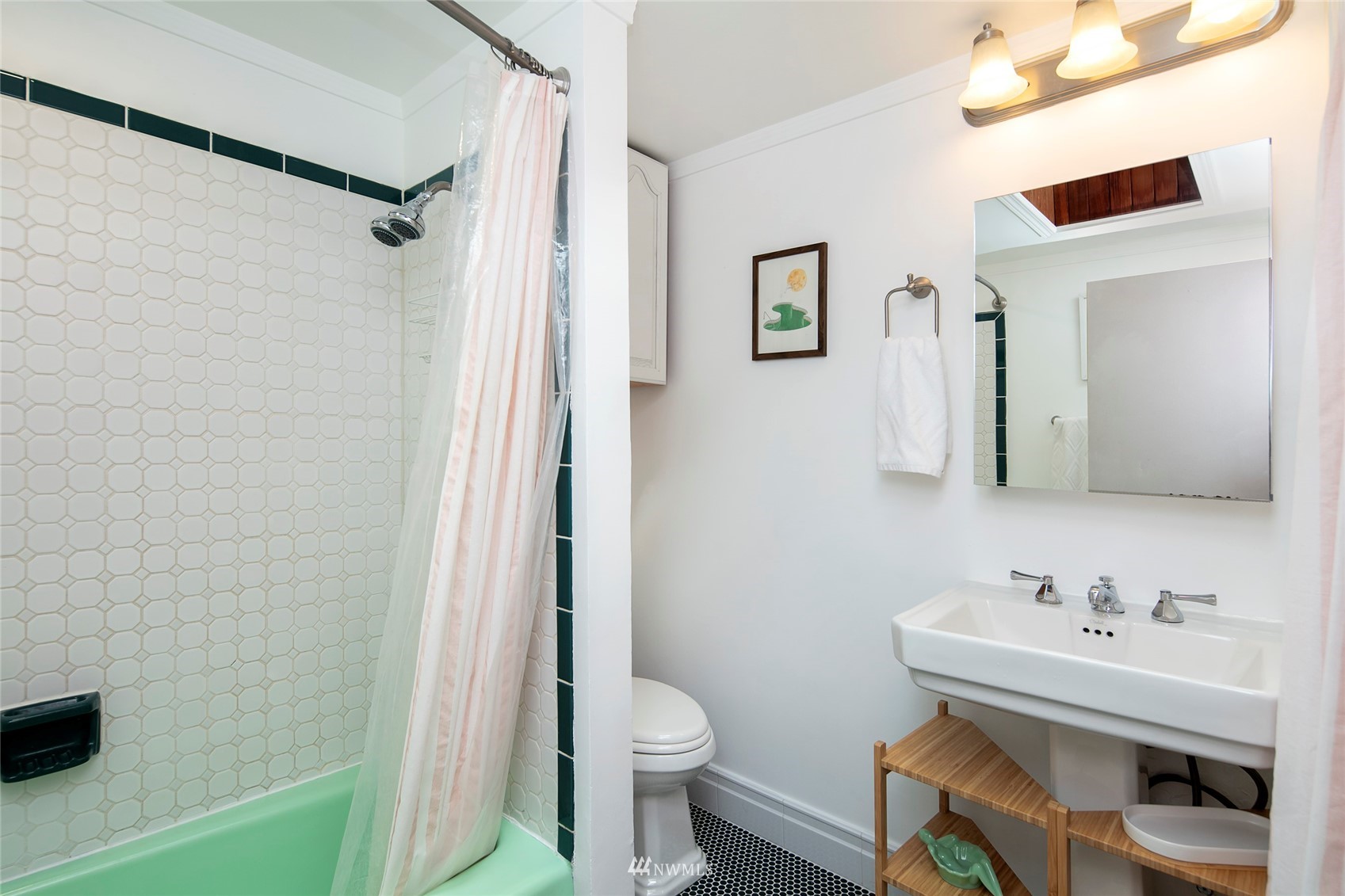 7141 47th Avenue Southwest Seattle, WA 98136 - Photo 17 of 27 a bathroom with a sink a toilet and shower