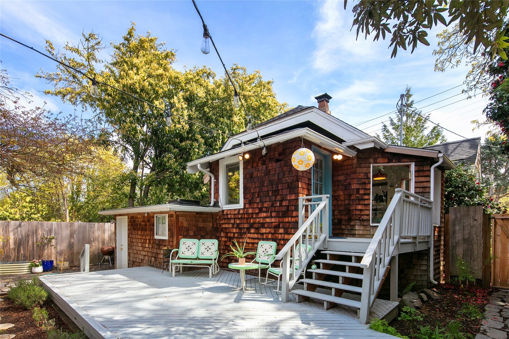 7141 47th Avenue Southwest Seattle, WA 98136 - Photo 19 of 27 a front view of house with deck and outdoor seating