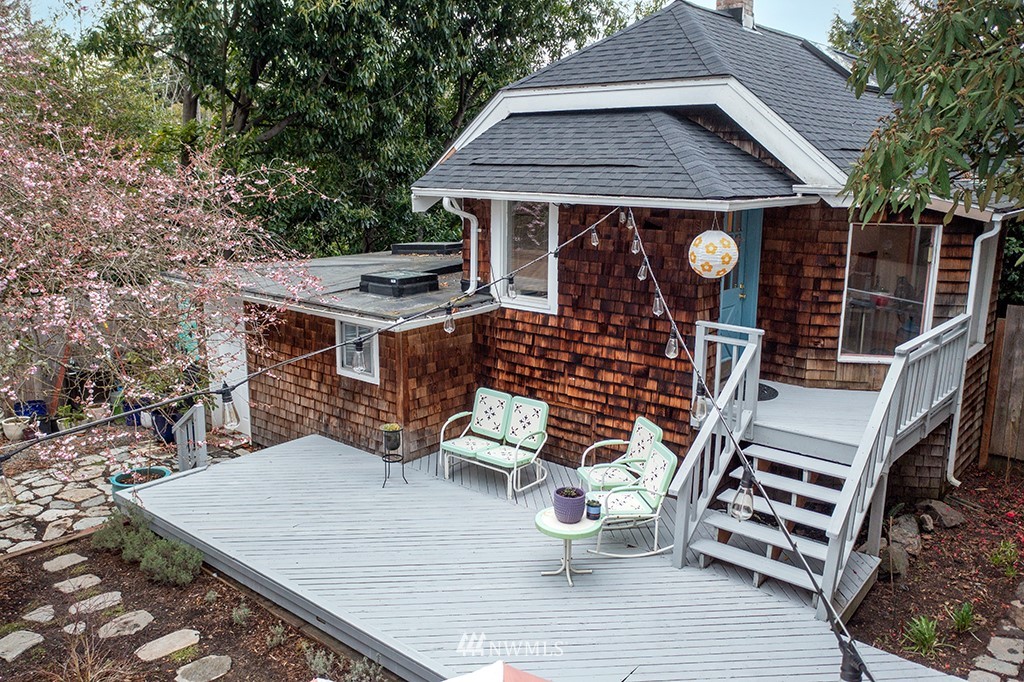 7141 47th Avenue Southwest Seattle, WA 98136 - Photo 23 of 27 a view of a roof deck with wooden floor and fence