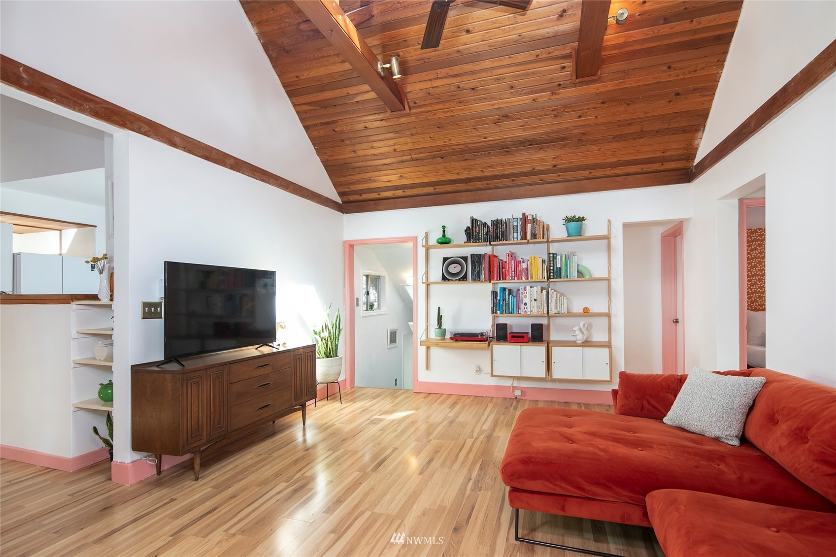 7141 47th Avenue Southwest Seattle, WA 98136 - Photo 3 of 27 a living room with furniture and a flat screen tv