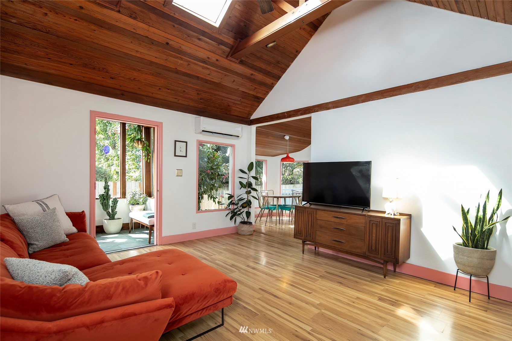 7141 47th Avenue Southwest Seattle, WA 98136 - Photo 4 of 27 a living room with furniture and a flat screen tv