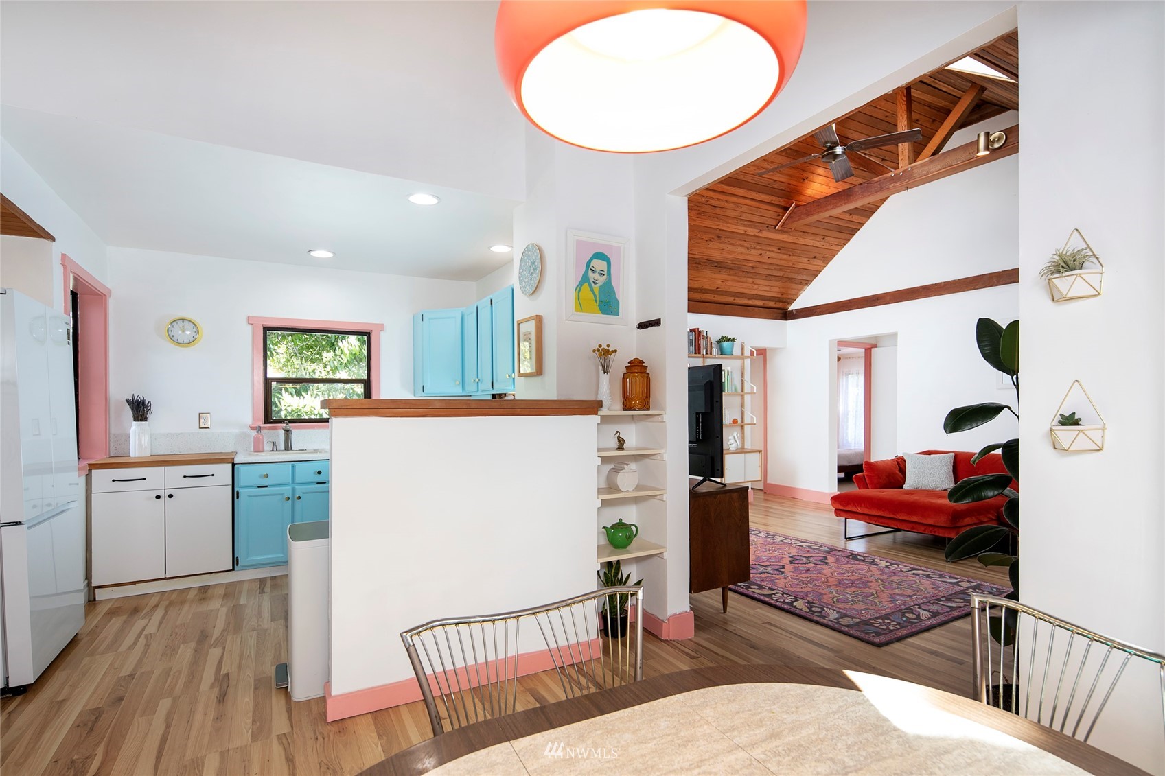 7141 47th Avenue Southwest Seattle, WA 98136 - Photo 5 of 27 a living room with furniture a wooden floor and next to a window