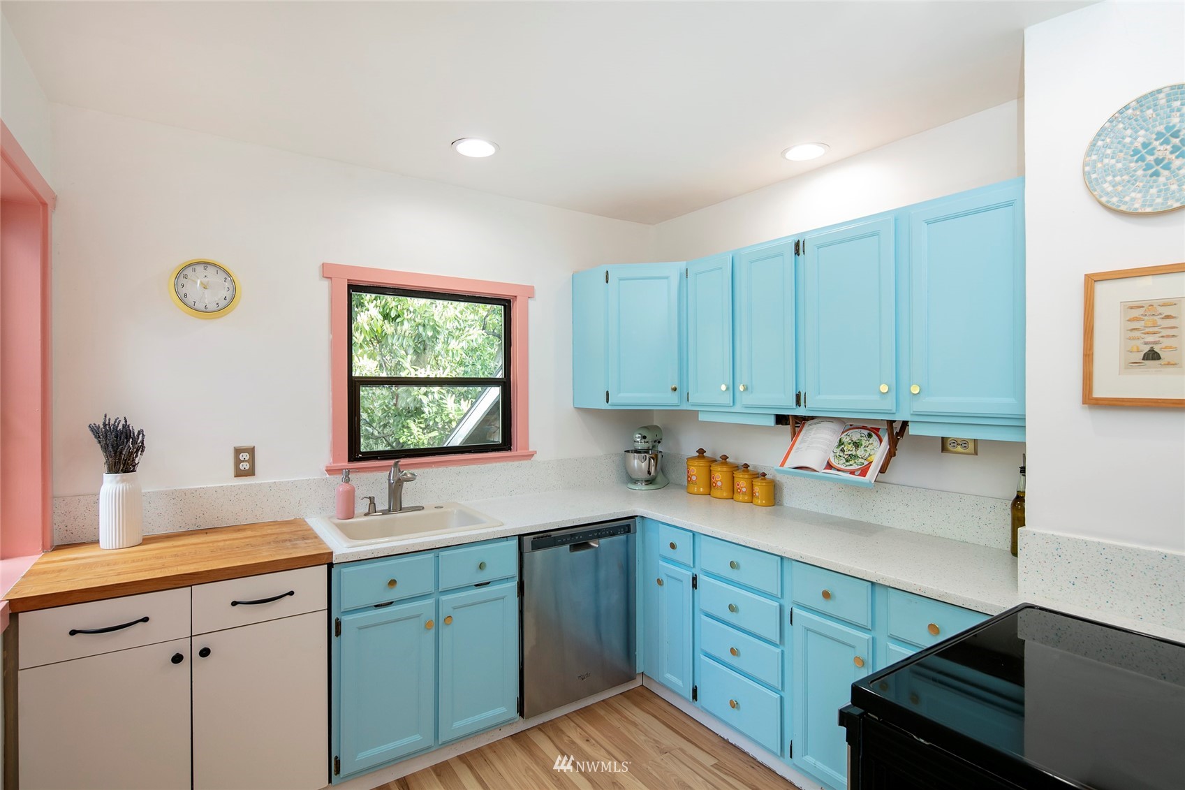 7141 47th Avenue Southwest Seattle, WA 98136 - Photo 7 of 27 a kitchen with sink cabinets and window