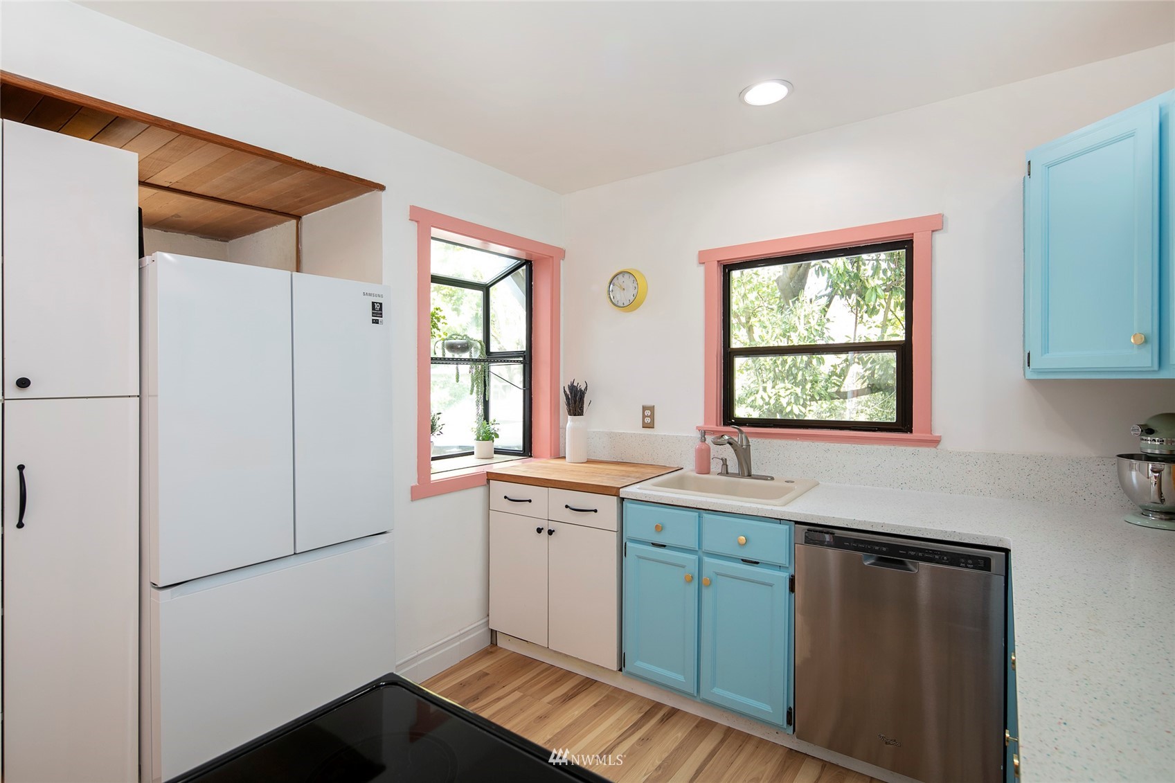 7141 47th Avenue Southwest Seattle, WA 98136 - Photo 8 of 27 a kitchen with a sink cabinets and window
