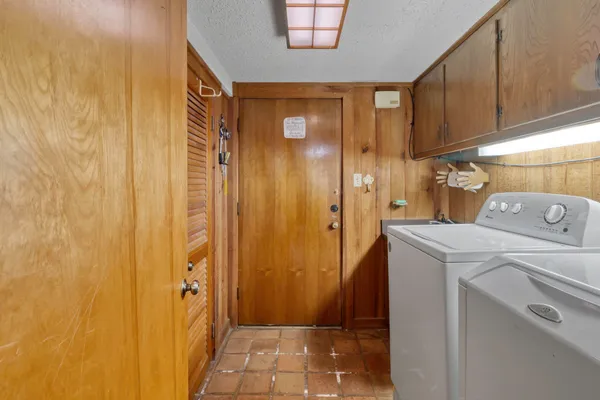 a room with furniture cabinets and a window