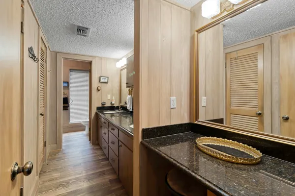 a bedroom with a bed and a couch