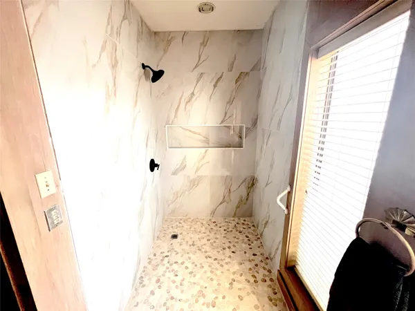 a bedroom with furniture and a chandelier