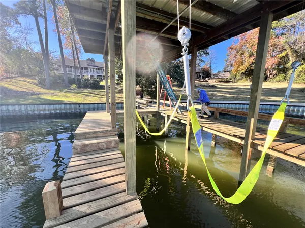 a living room with furniture a fireplace and a table