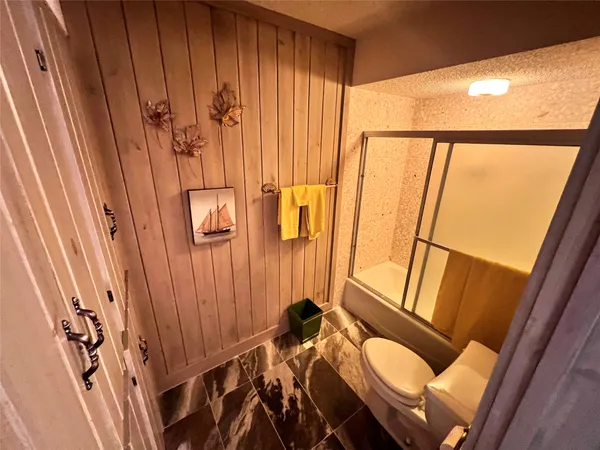 a view of a deck with a large trees