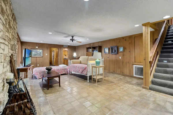 an aerial view of a house with garden space and street view