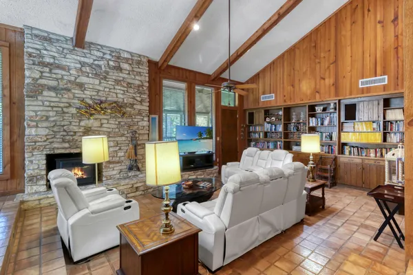 a living room with furniture and a table