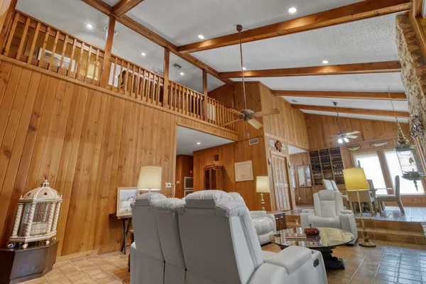 a view of a dining room with furniture wooden floor and chandelier