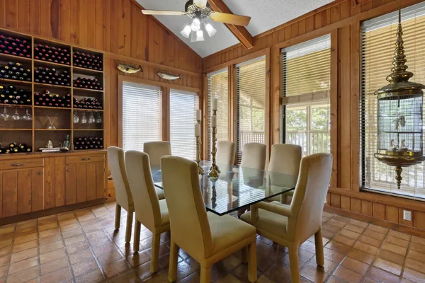 a bathroom with a granite countertop toilet sink and mirror