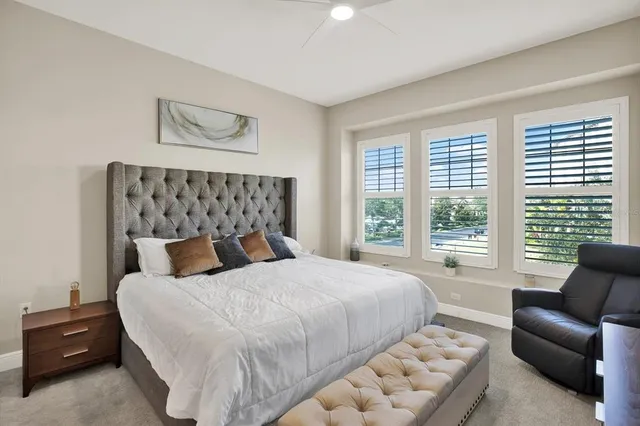 a bedroom with a bed and a couch