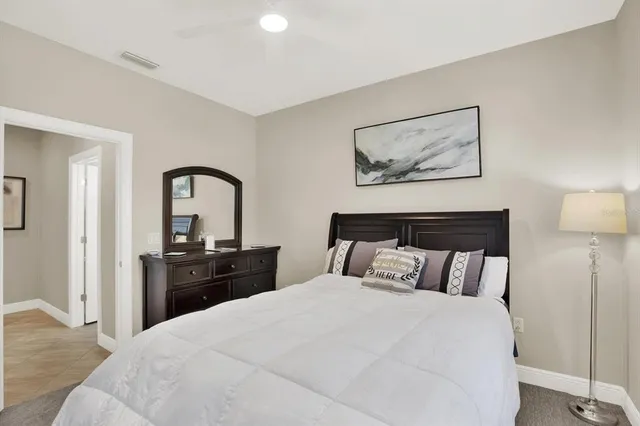 a bedroom with bed and a dresser