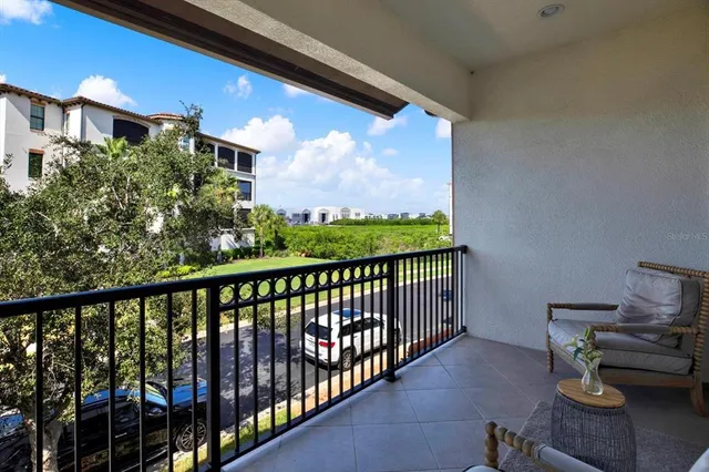 a view of a balcony with chairs