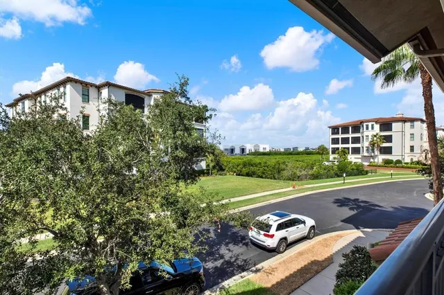 a view of a yard with cars