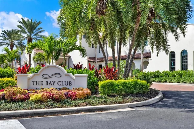 a view of sign board with flower around
